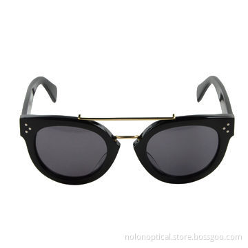 Acetate sunglasses in black with gold metal
